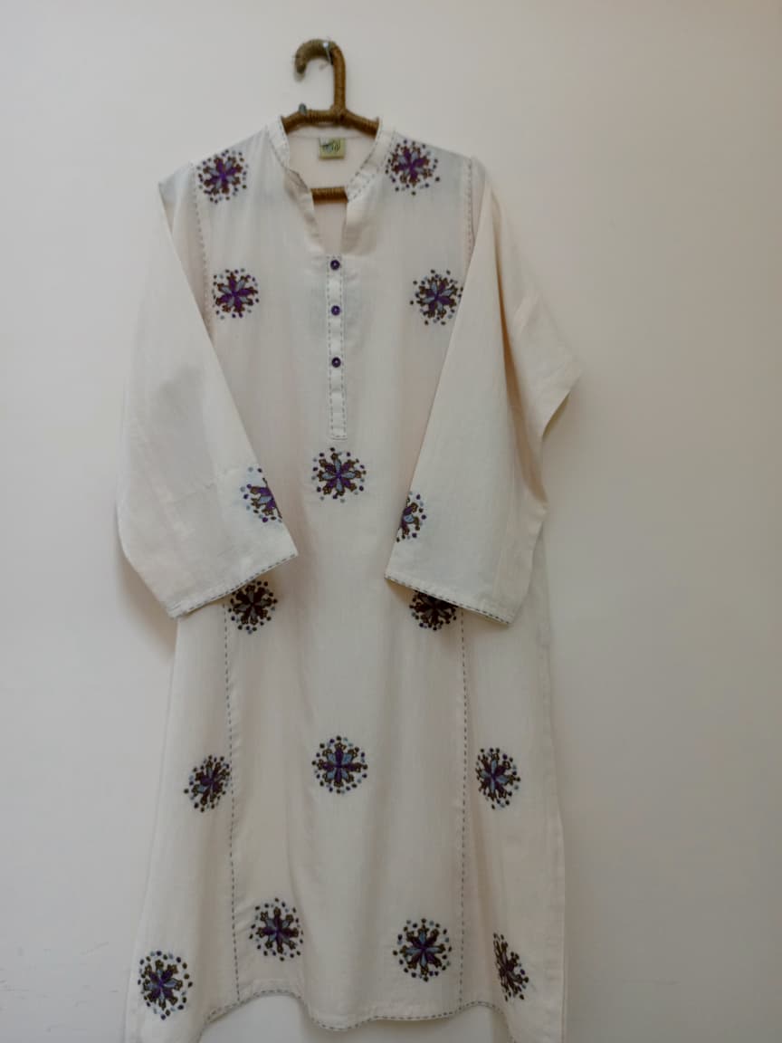 Soft cotton kurti adorned with delicate hand embroidery. Perfect for casual and semi-formal wear.